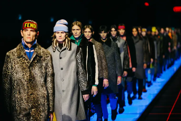 Menswear line-up on a lit runway