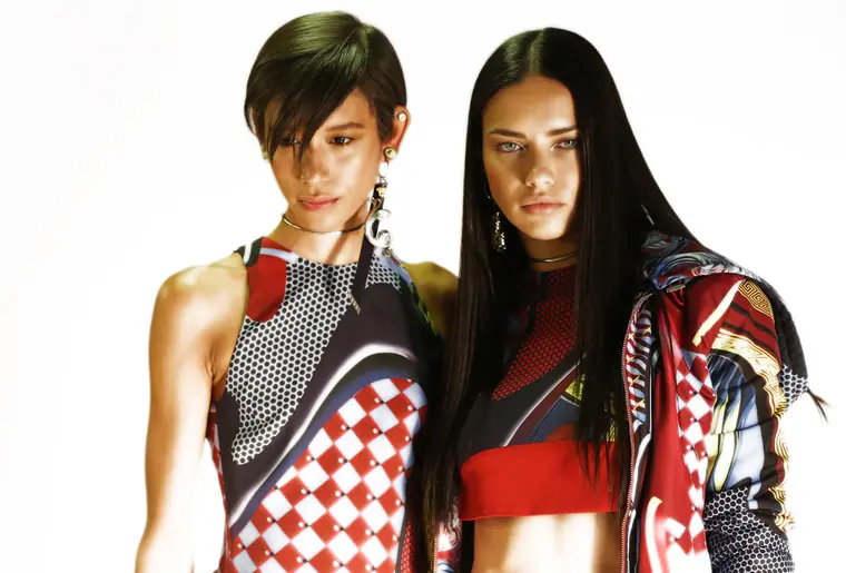Two models in red and white sportswear