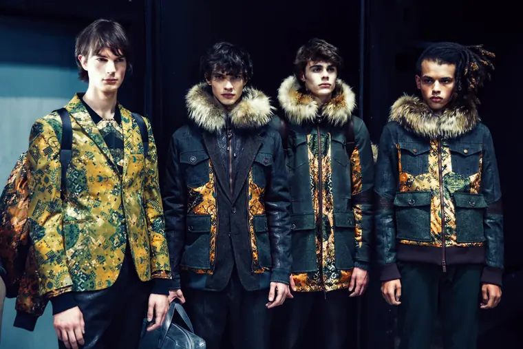 Three male models in gold and fur jackets