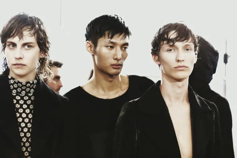 Three models in black tailoring