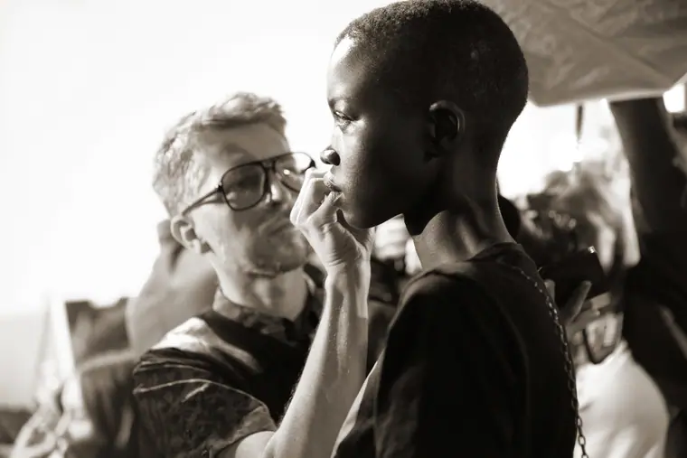 Black and white: a hairstylist working on a model