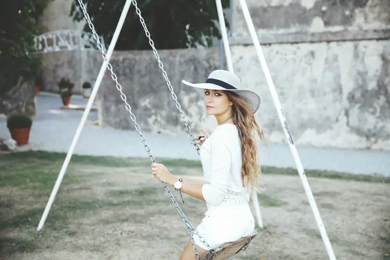 Elisha on a swing, dressed in white