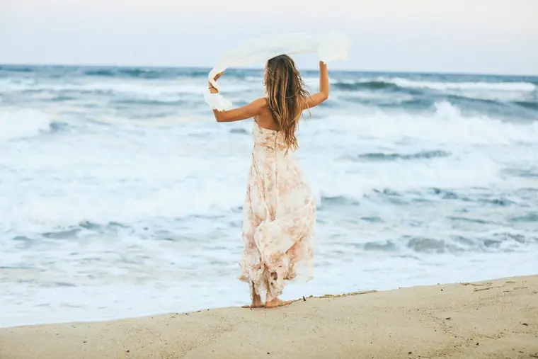 Elisha at the shoreline in a flowing dress