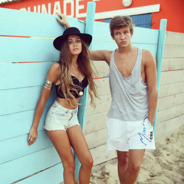 Elisha Naomi Daniel with Salomo Daniel by a beach hut