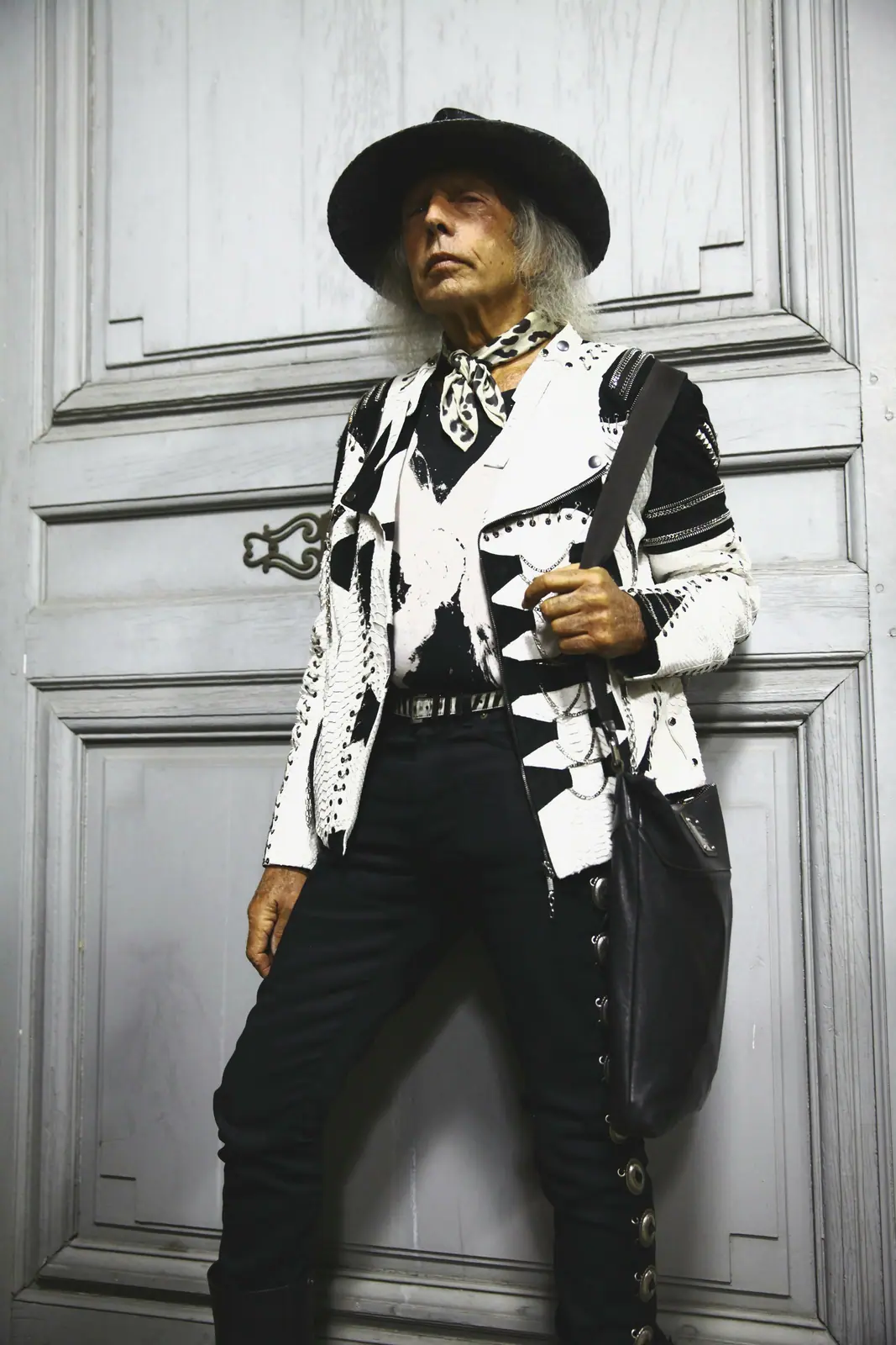 James Goldstein in a hat and patterned jacket