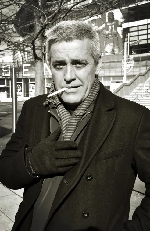 Mauro Naves in a coat, black and white